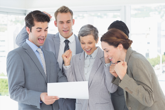 A team of corporate individuals analyzing a document